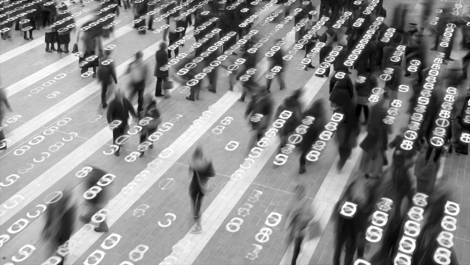 People walking under binary code