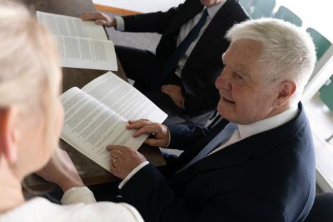 Sir Wyn William's reading Volume 1 of his final report